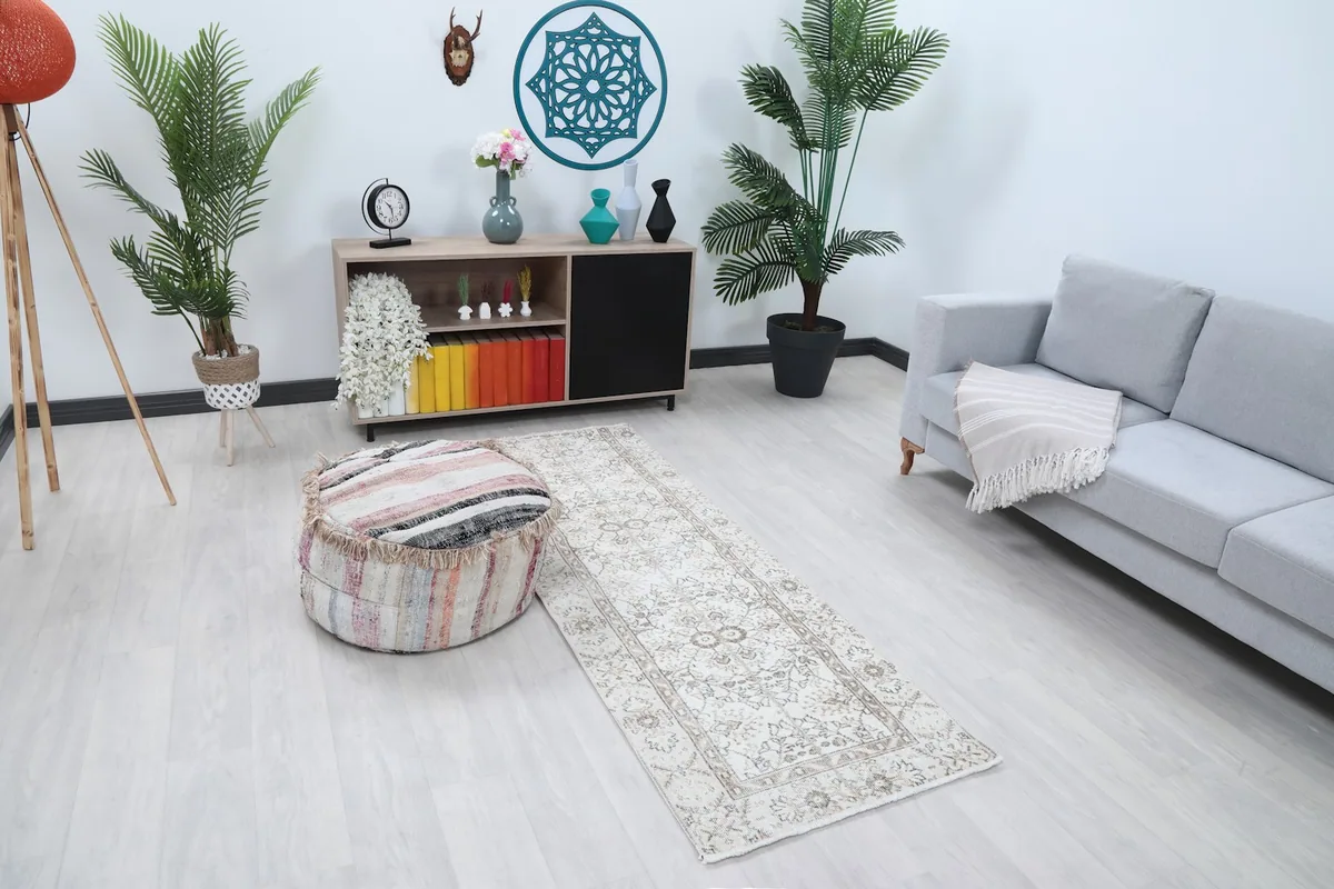 Angle view of the runner rug in a room, highlighting its neutral tones.