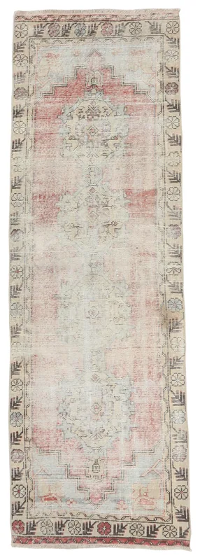 Full overhead view of the rose and beige vintage Anatolian runner rug