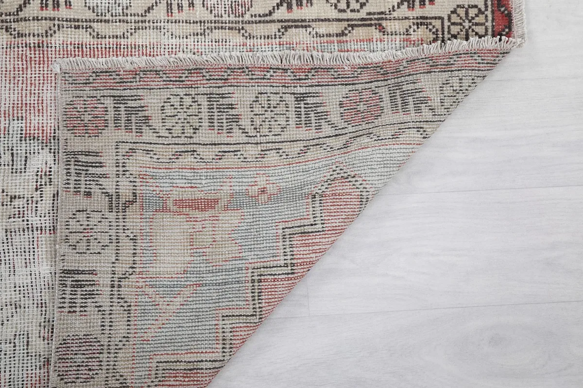 Close-up of the back of the rug, showing the reverse side of the hand-knotted construction