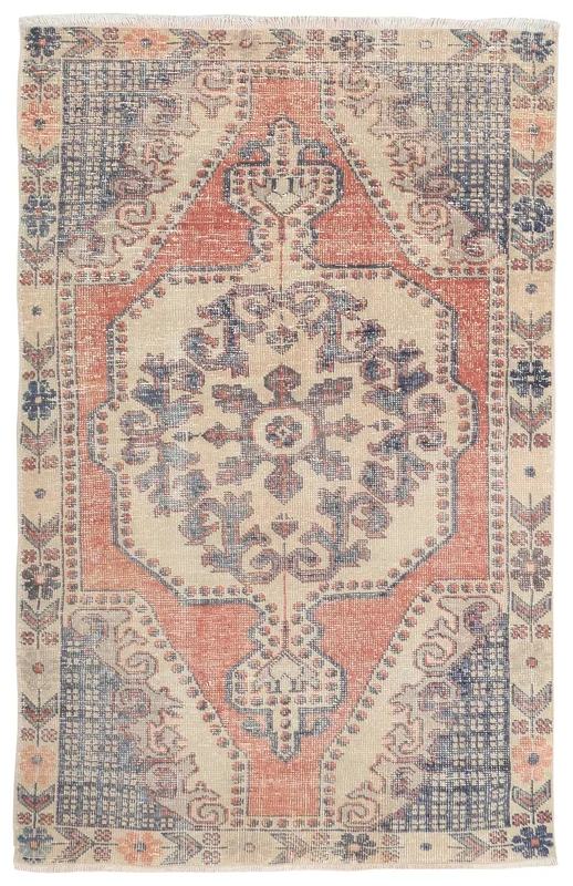 Full top view of the 4x7 ivory, rust, and blue vintage Anatolian rug on a white background