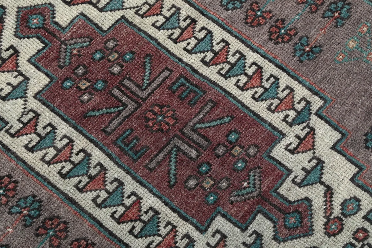 Close-up of the intricate tribal motifs and colors within the central medallion.
