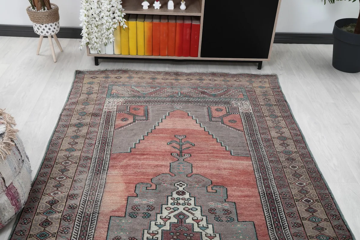 Overhead view of the vintage runner rug in a room, showing its full length and design.