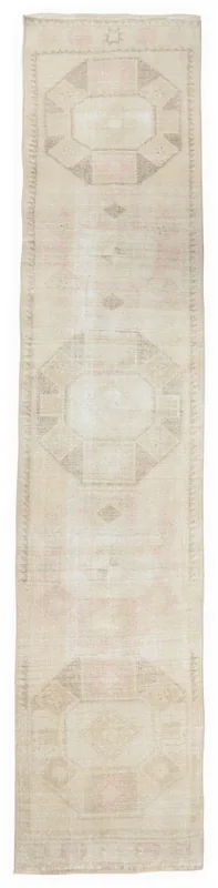 Full top view of the 2'7" x 12'5" vintage Anatolian runner rug on a white background