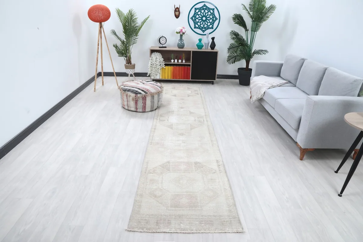 Runner rug in a modern living room setting, viewed from a wide angle