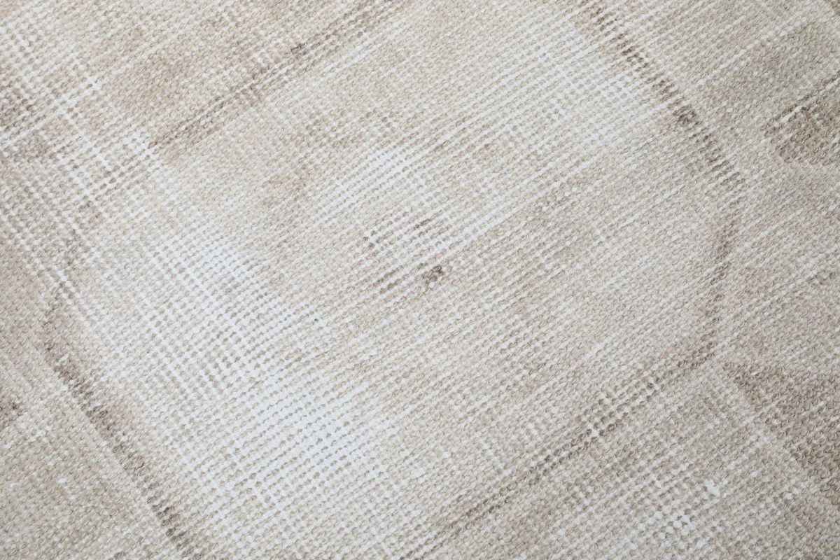 Close-up view of the low wool pile and a faded geometric design