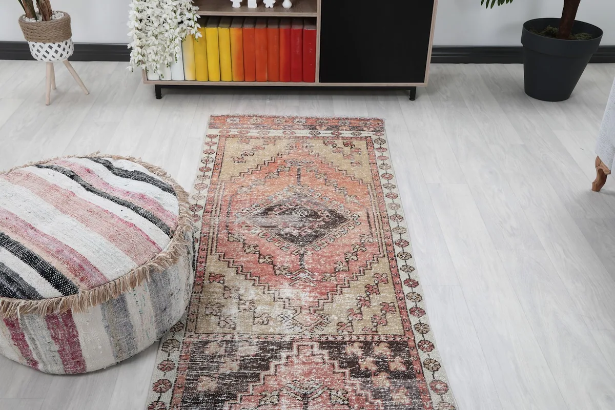 View of the runner rug from the opposite end in the room setting, showing its full length.