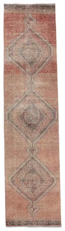 Full overhead view of the rose and charcoal geometric vintage Anatolian runner