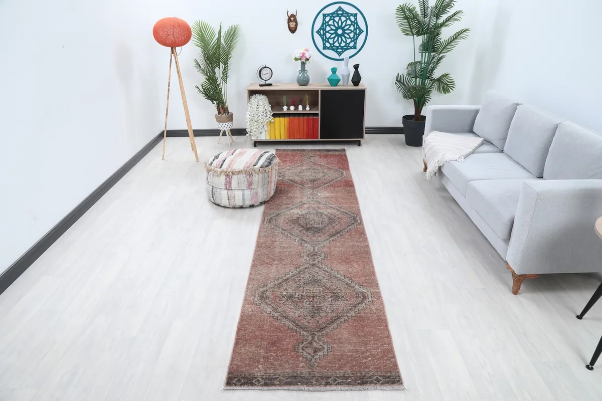 Runner placed in a living room scene with light flooring and modern furniture