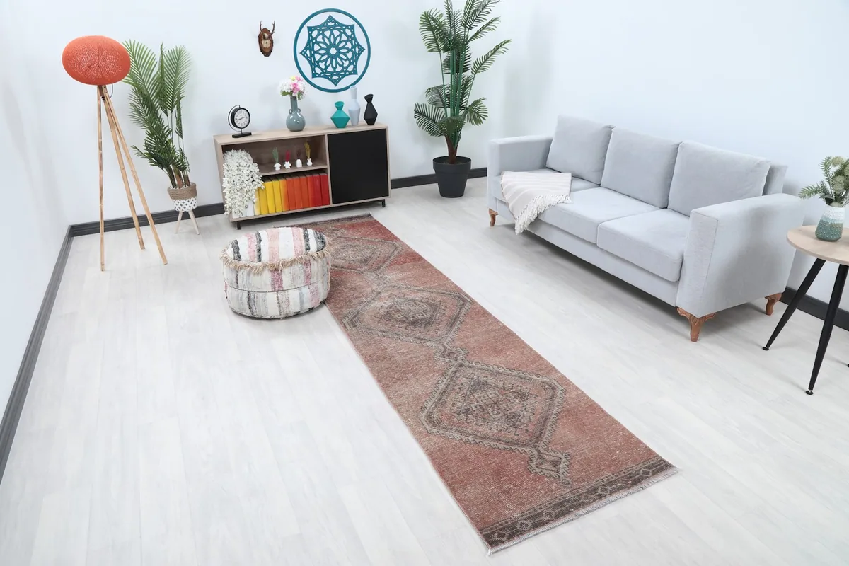 Angled view of the runner in a living room, showing its length and colors