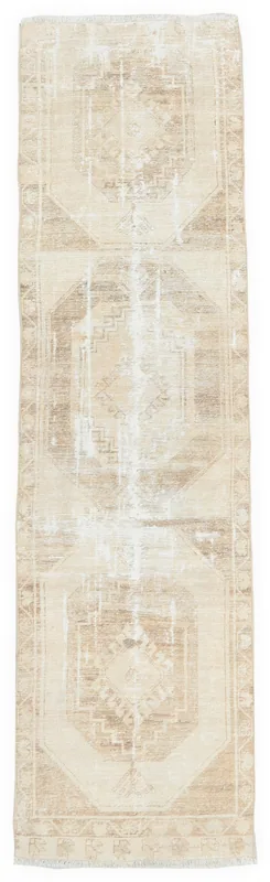 Full overhead view of the 2'9" x 10'10" beige and tan geometric vintage runner rug on a white background.