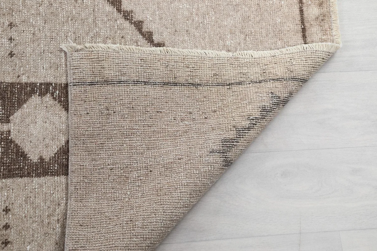 Close-up of the back of the runner rug, showing the tight knotting and craftsmanship.
