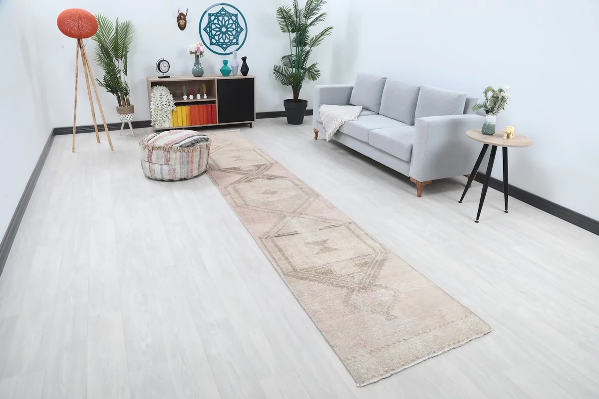 Angle view of the runner rug in a living room, showing its length and pattern