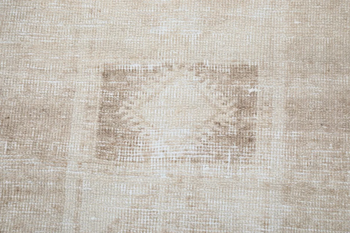 Texture and pattern detail, highlighting the low pile and vintage wear