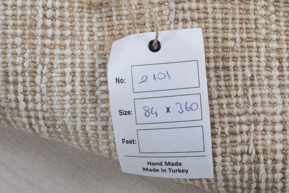 Tag showing rug dimensions in centimeters and 'Hand Made in Turkey'