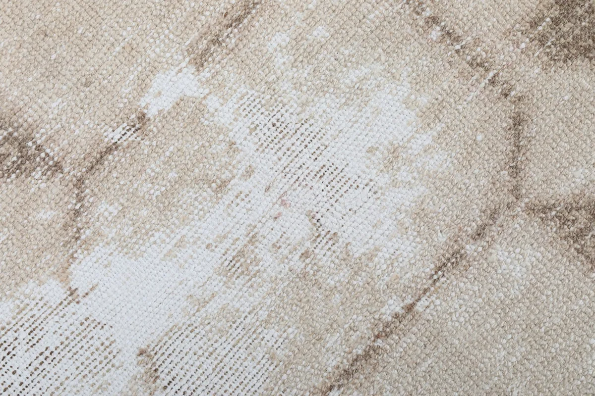 Close-up of the low wool pile texture and distressed wear on the vintage runner rug