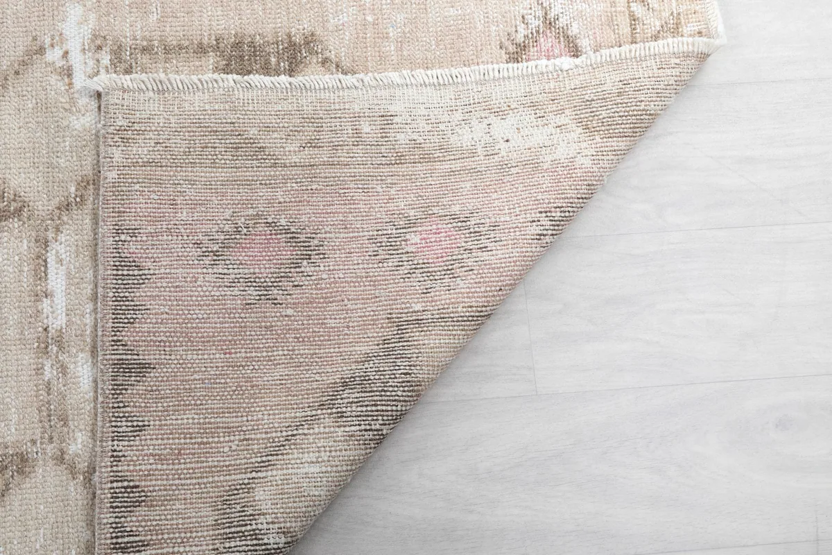 View of the underside of the vintage runner, showing the tight hand-knotted construction