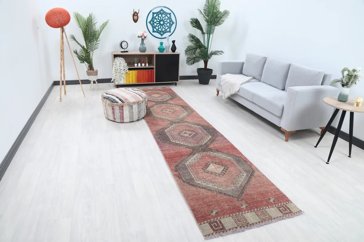 Angled view of the rust runner rug in a modern living space, highlighting its design and fit.