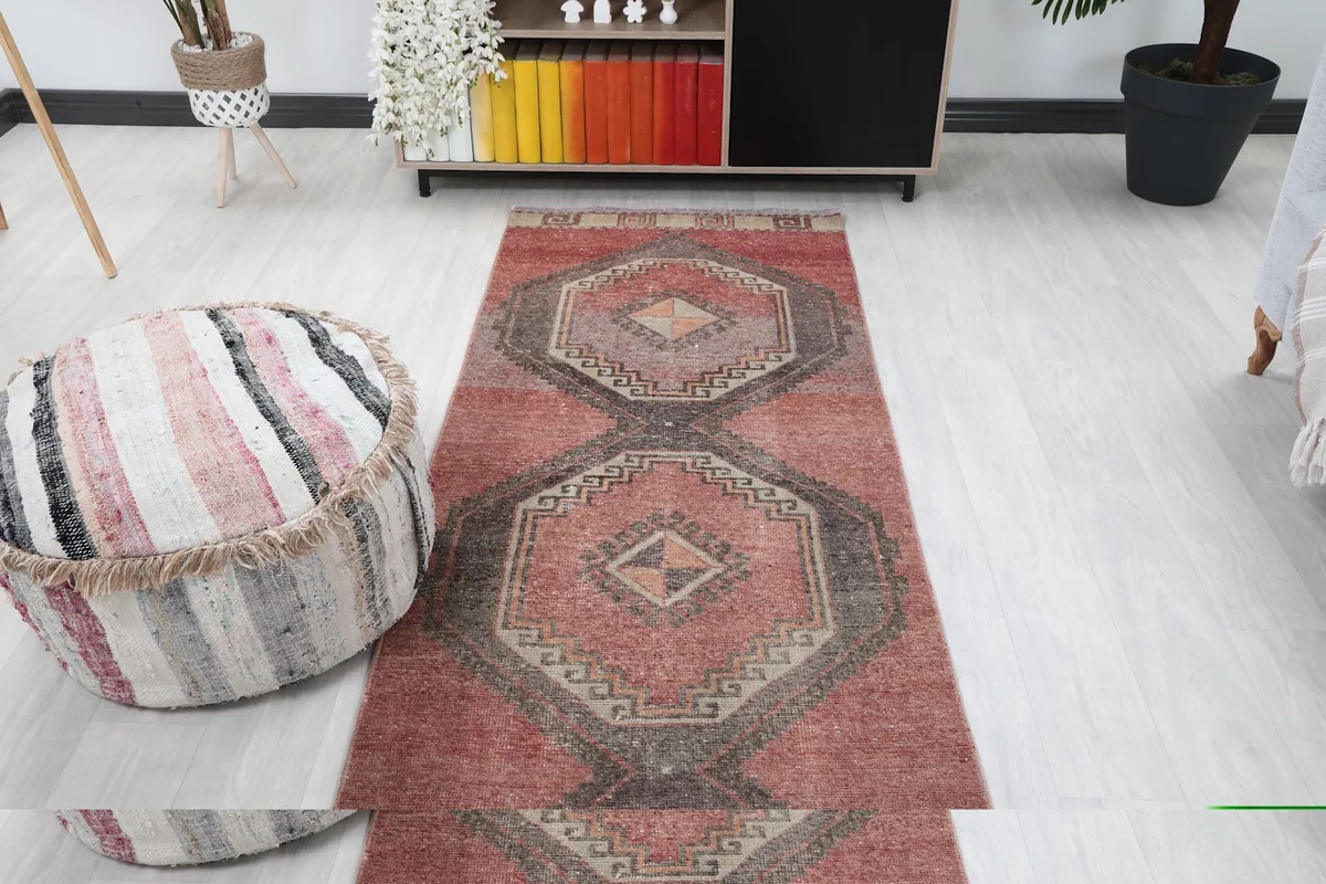 Another overhead view of the runner rug in a room, slightly different angle, showing decor elements.