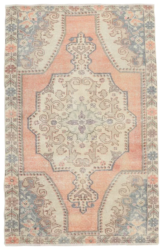 Full top view of the rust, beige, and blue vintage Anatolian rug.
