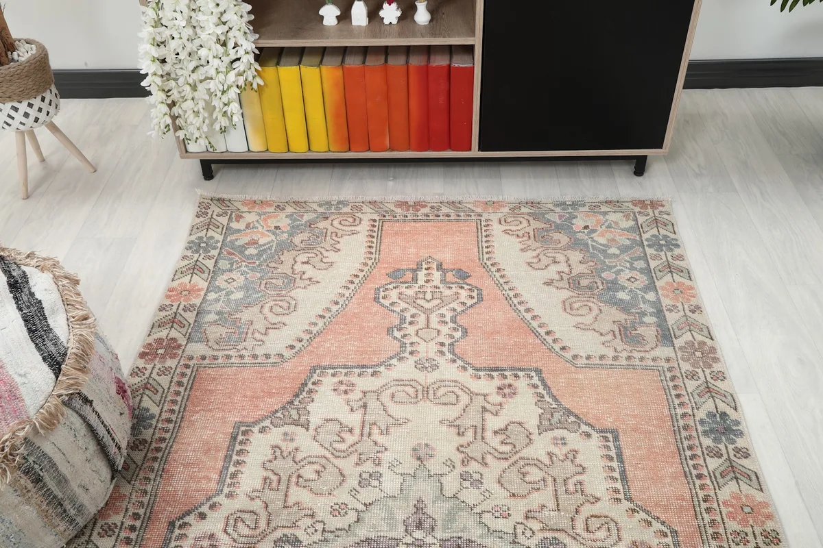 Overhead view of the rug in a room, highlighting the full design and colors.