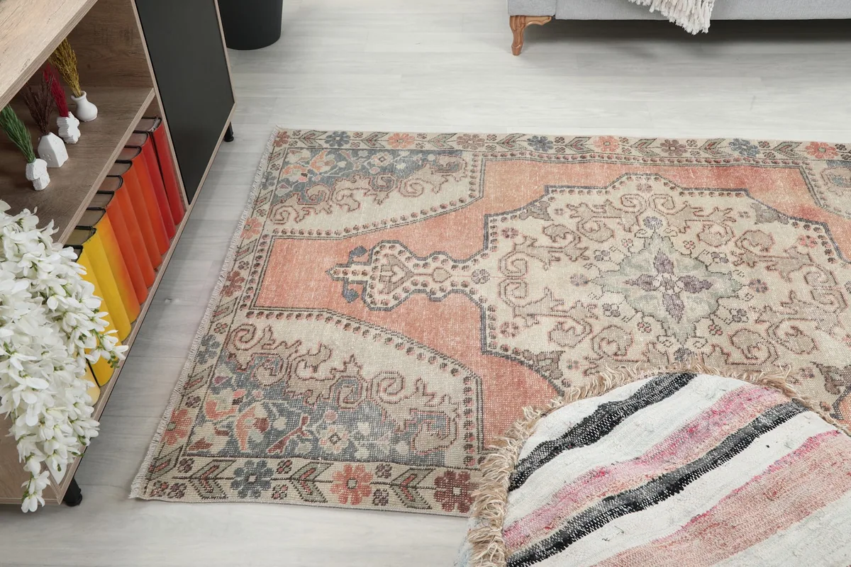 Wide angle view of the rug in a living room, capturing its overall presence.