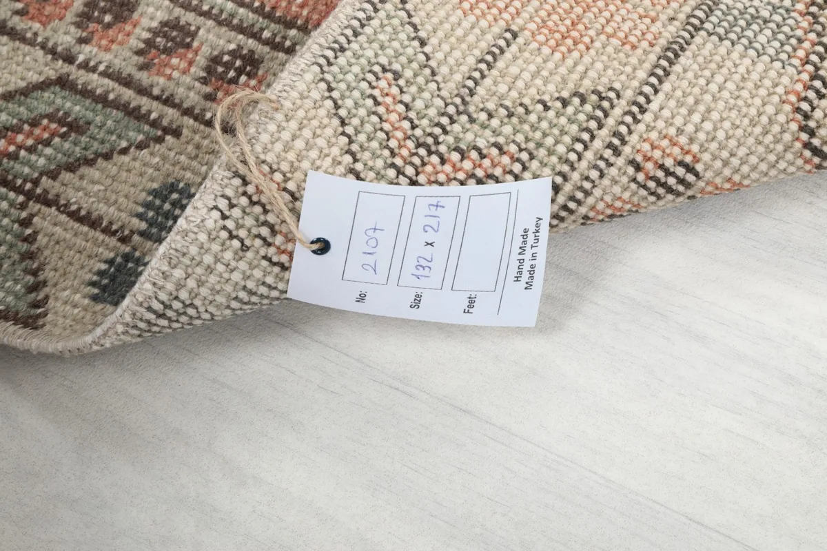 Close-up of the rug's label, indicating its size and origin from Turkey.
