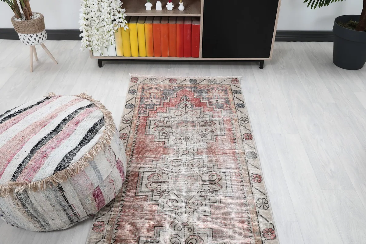 Overhead view of the runner rug in a room, showing its full length and the surrounding decor.