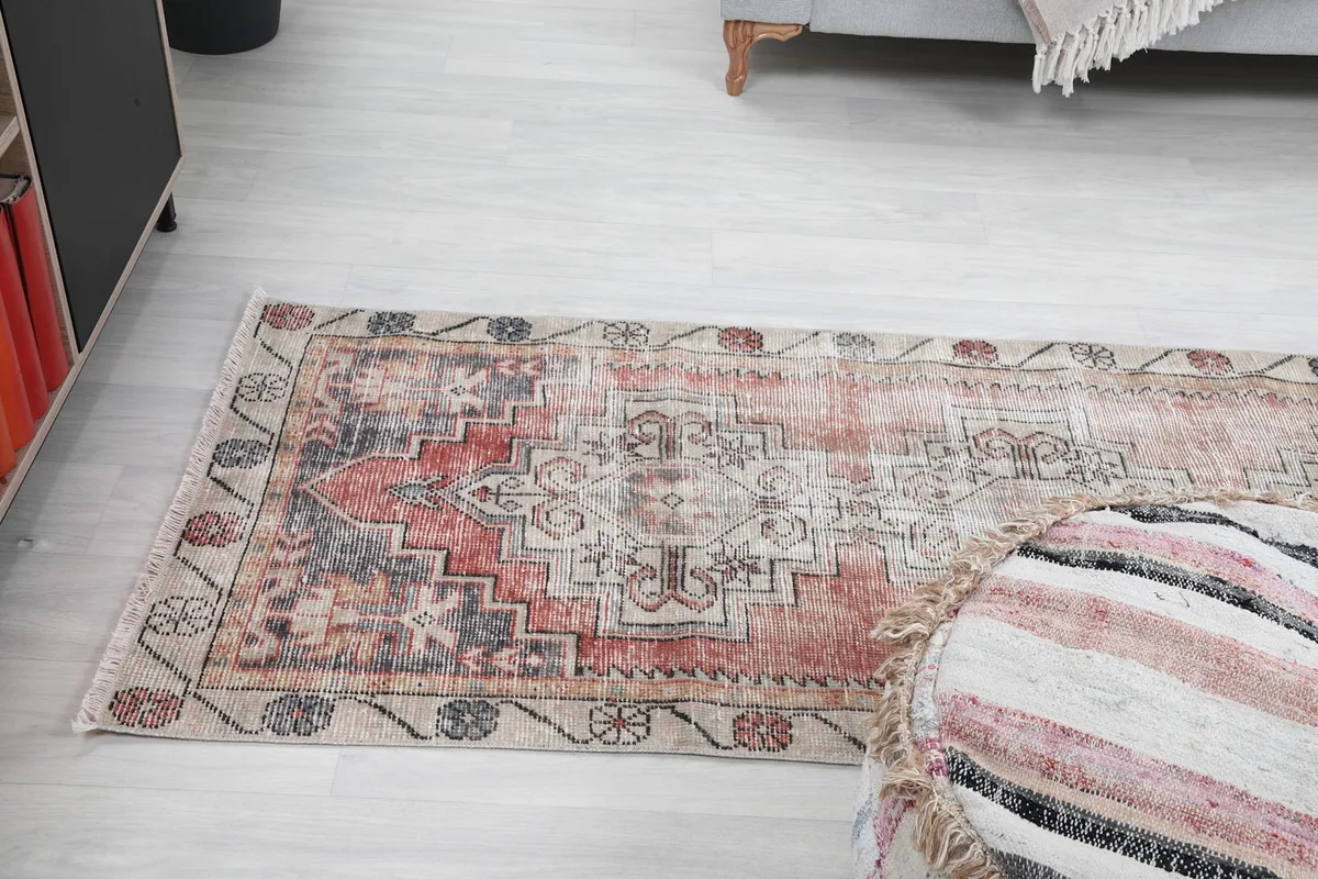 Runner rug from an elevated angle in a room setting, showcasing its elongated shape and design.