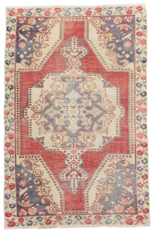 Full overhead view of the vintage red and ivory Anatolian wool rug