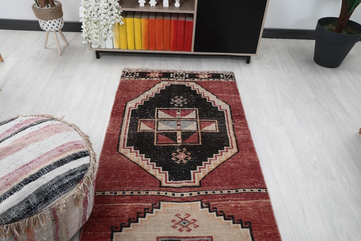 Overhead view of a section of the runner rug, highlighting the repeating medallion pattern