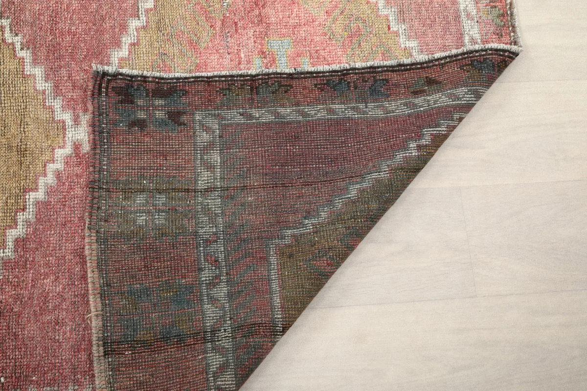 Detailed view of the reverse side of the rug, showing the knotting and foundation