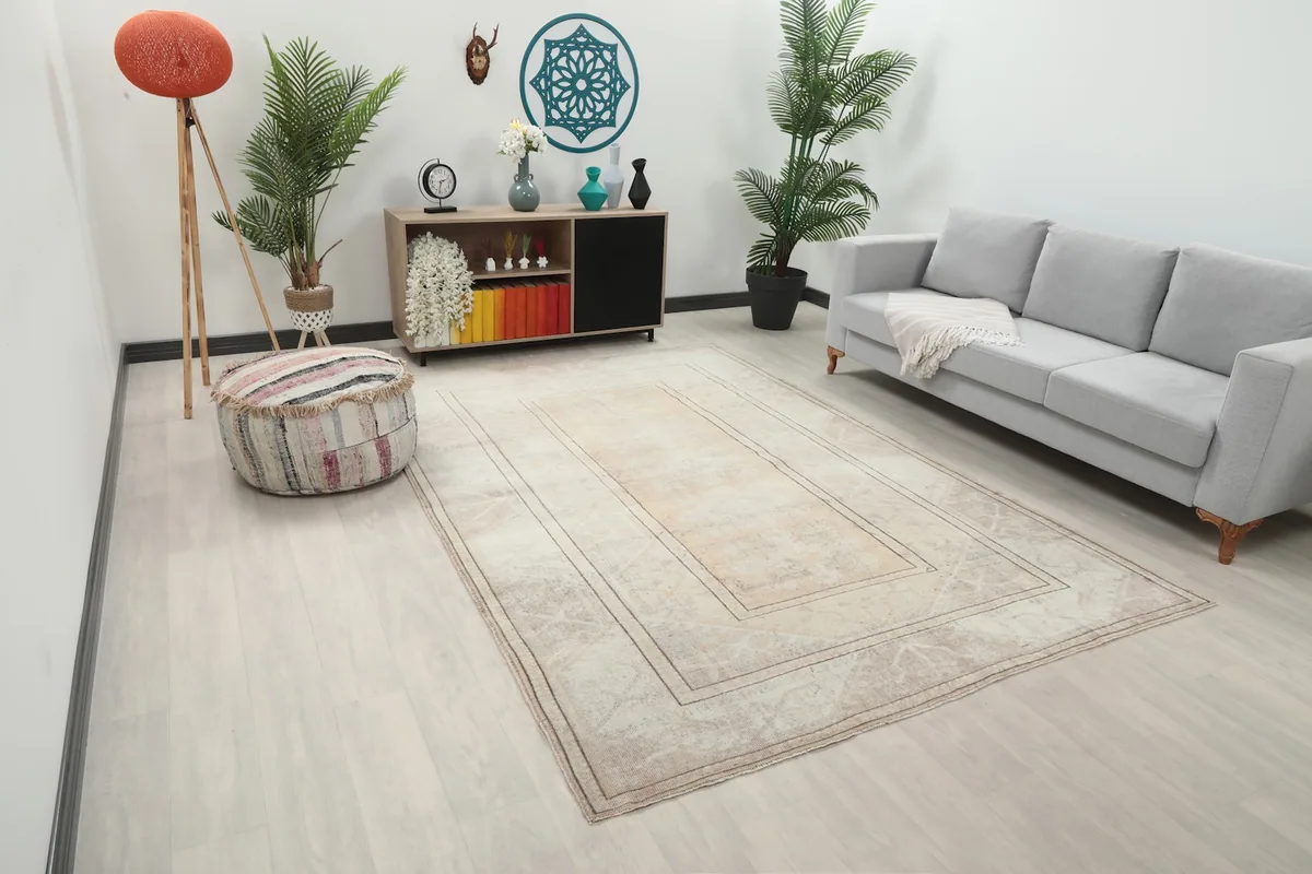 Angle view of the hand-knotted beige rug in a contemporary living space
