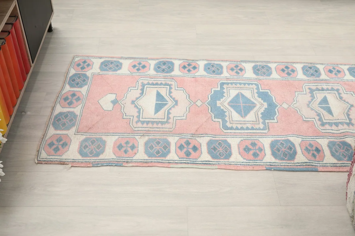 Overhead view of a section of the runner, showing the repeating central motifs