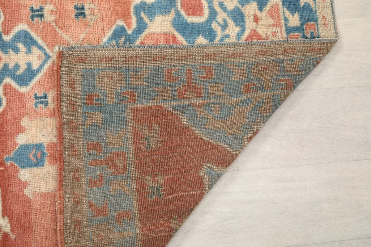Close-up of the back of the hand-knotted rug, showing its construction.