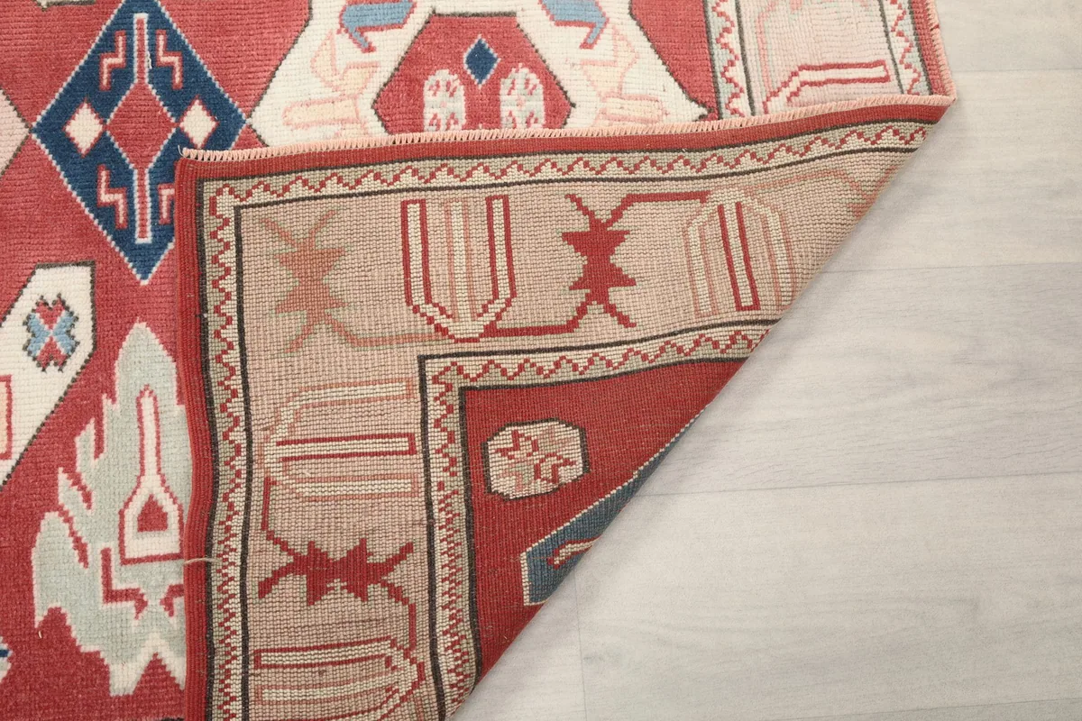 Another folded corner view, showing the construction of the rug from the back and front.