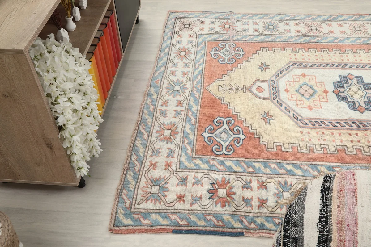 Angled view of the rug's side, showing its colors and textures in a room