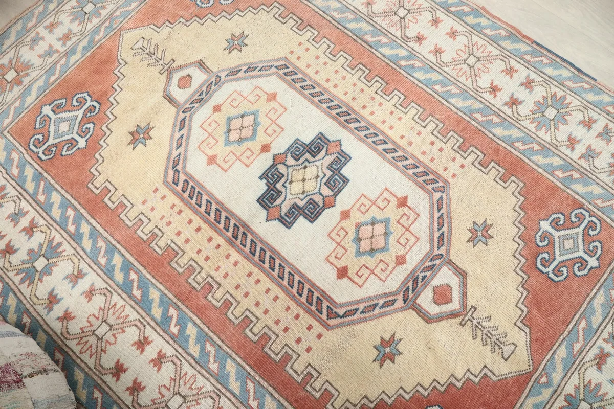 Overhead close-up of the rug's central medallion and surrounding tribal patterns