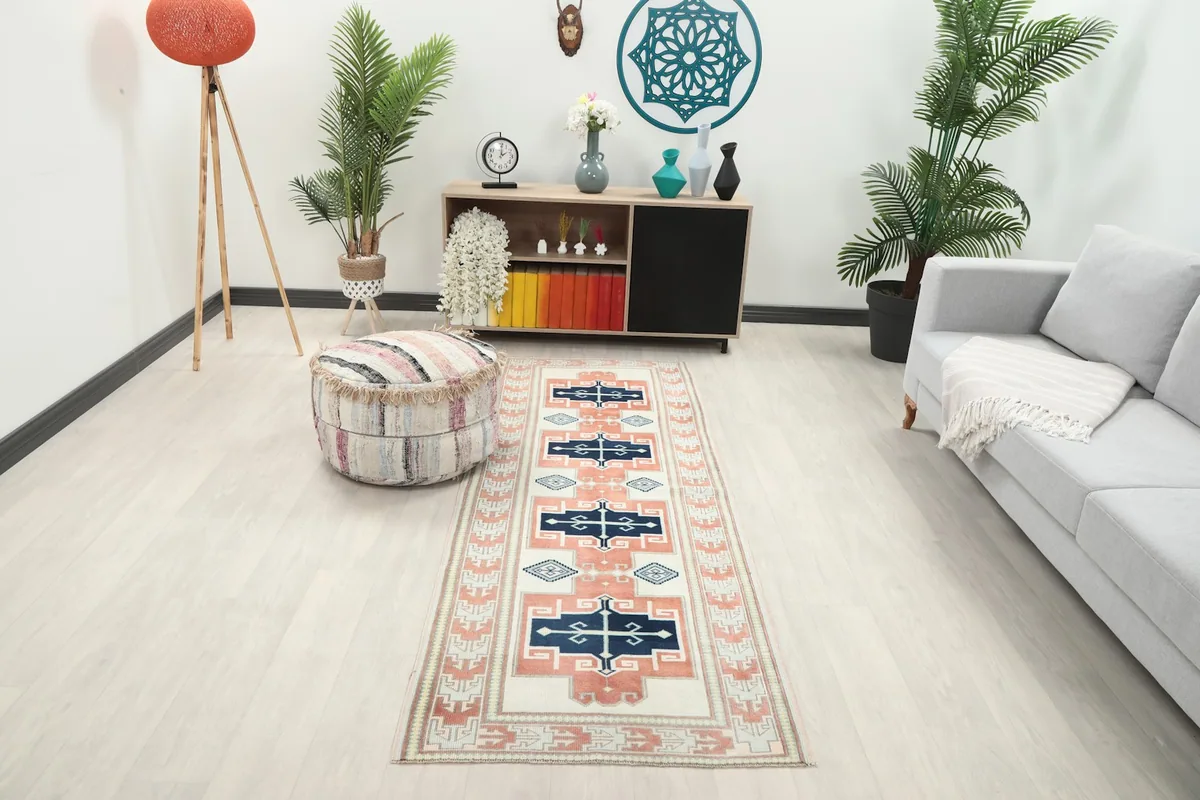 Runner displayed in a modern hallway setting with a light floor, showing its full length and colors.