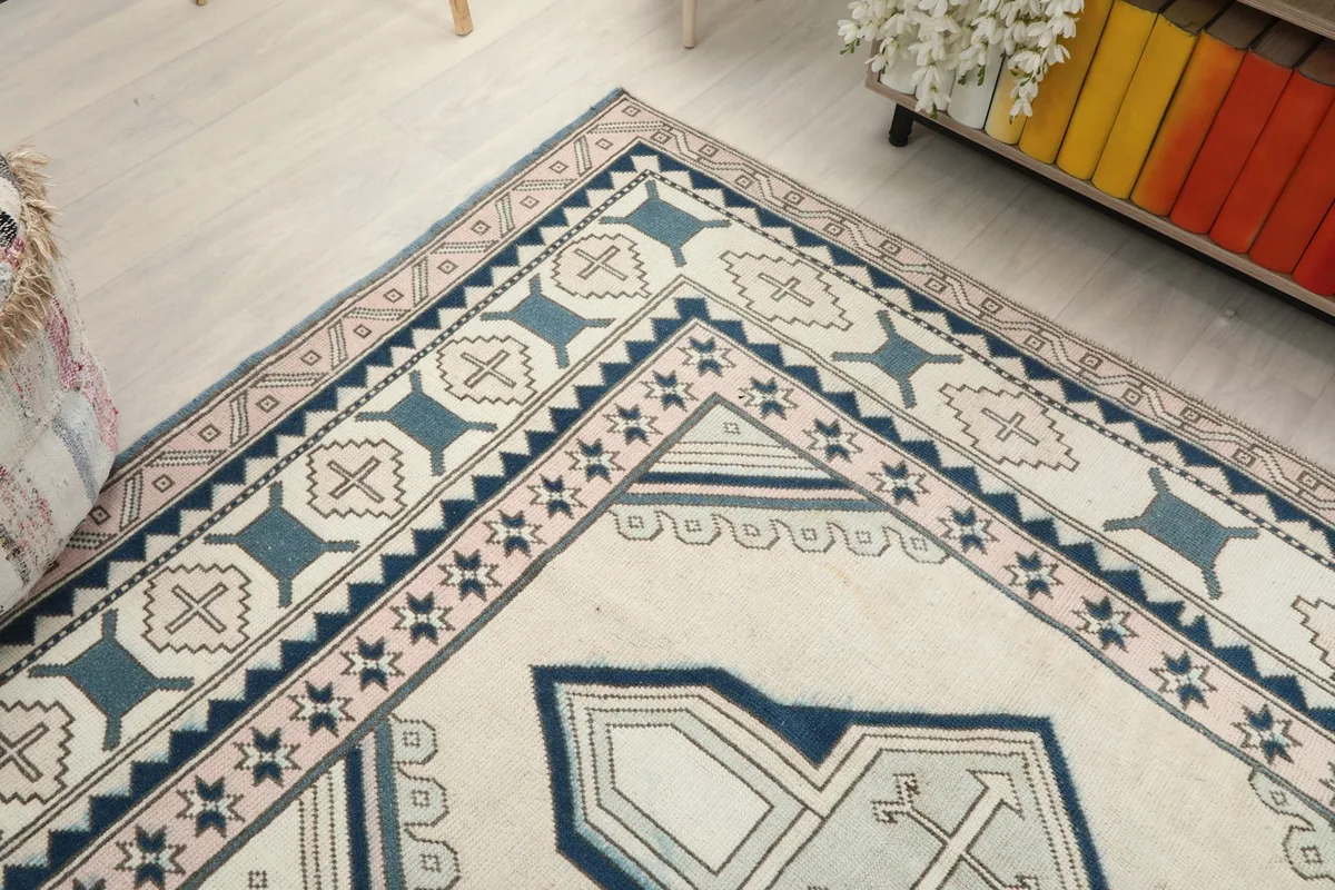 Angled view of the rug's corner, showing the interplay of the border and field design