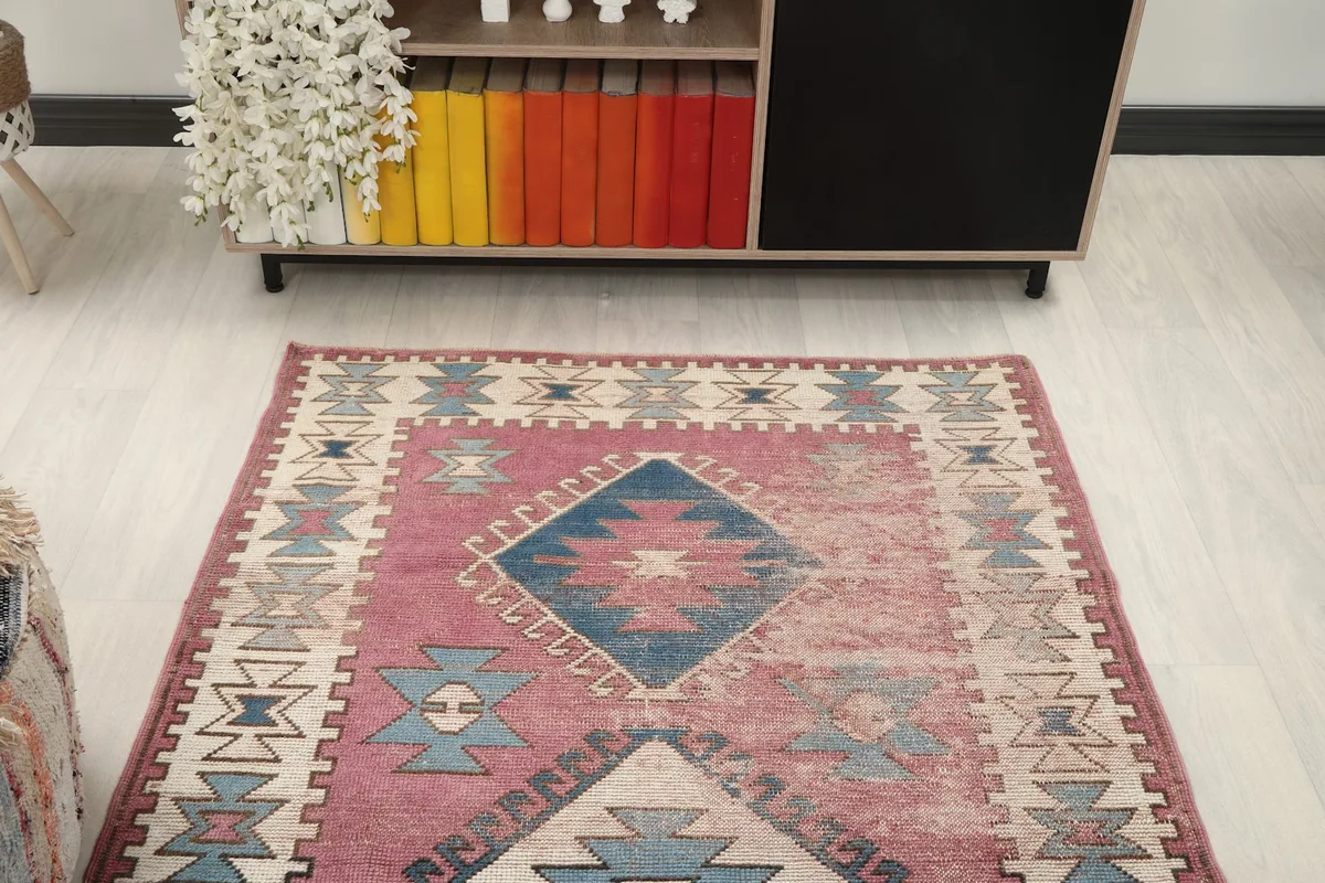 Overhead view of the rug showing its full design and colors in a room setting