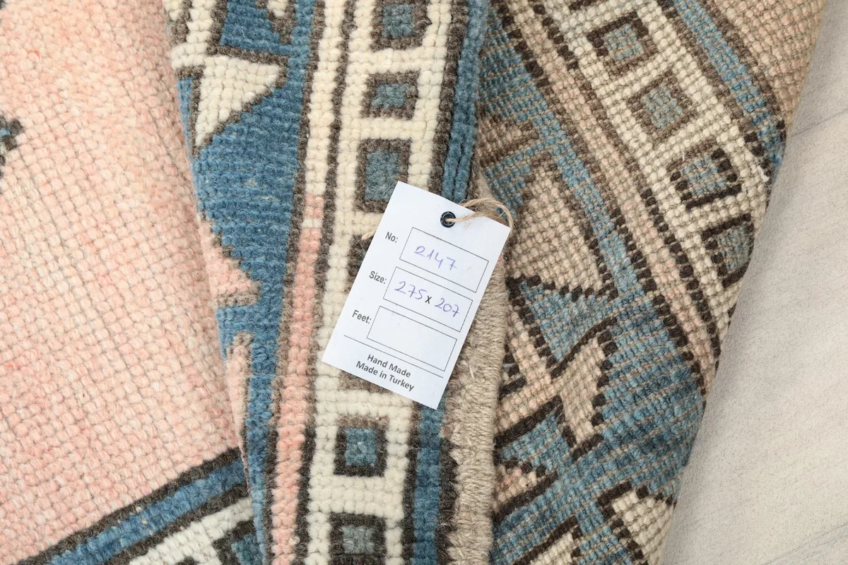 Close-up of the rug's reverse side and a product tag showing size details