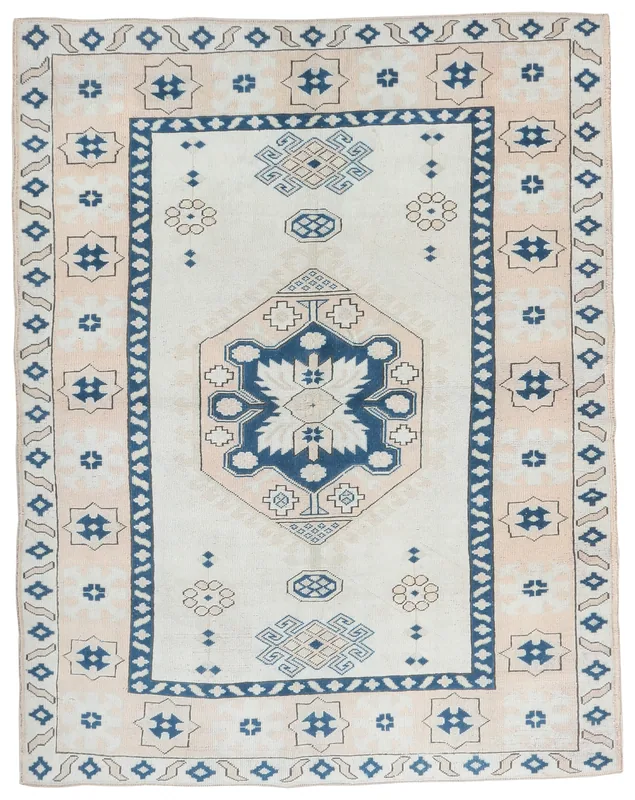 Full top view of the cream and navy geometric vintage Anatolian rug