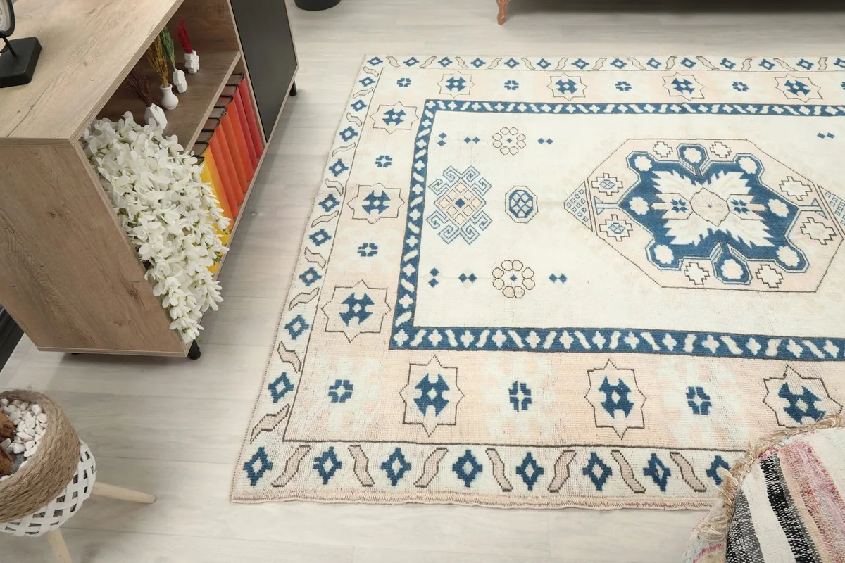 Overhead view of the rug in a room, showing its full design and scale
