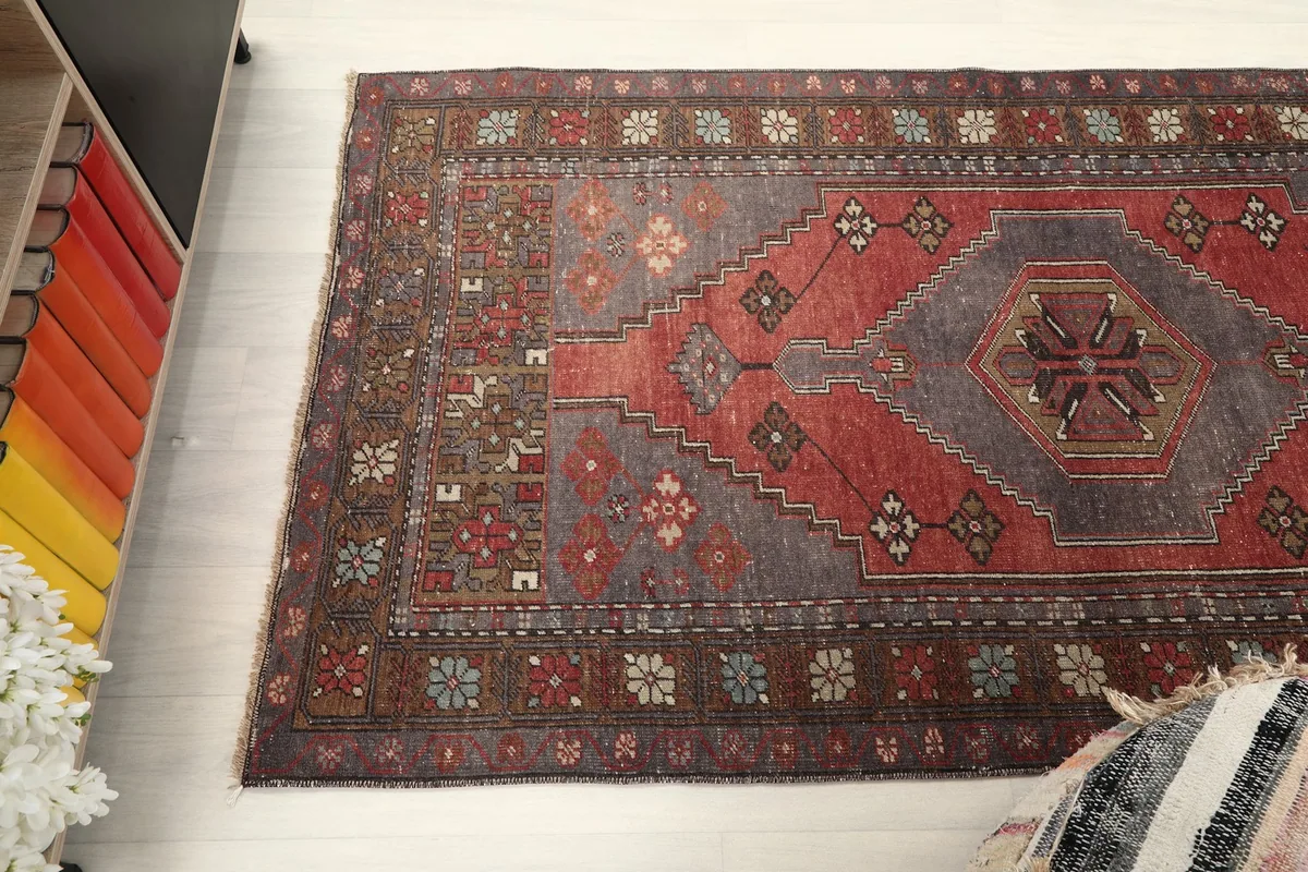 Overhead view of the rug, highlighting its rust, gray, and brown color palette