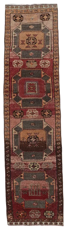 Full top view of the vintage red geometric Anatolian runner on a white background.