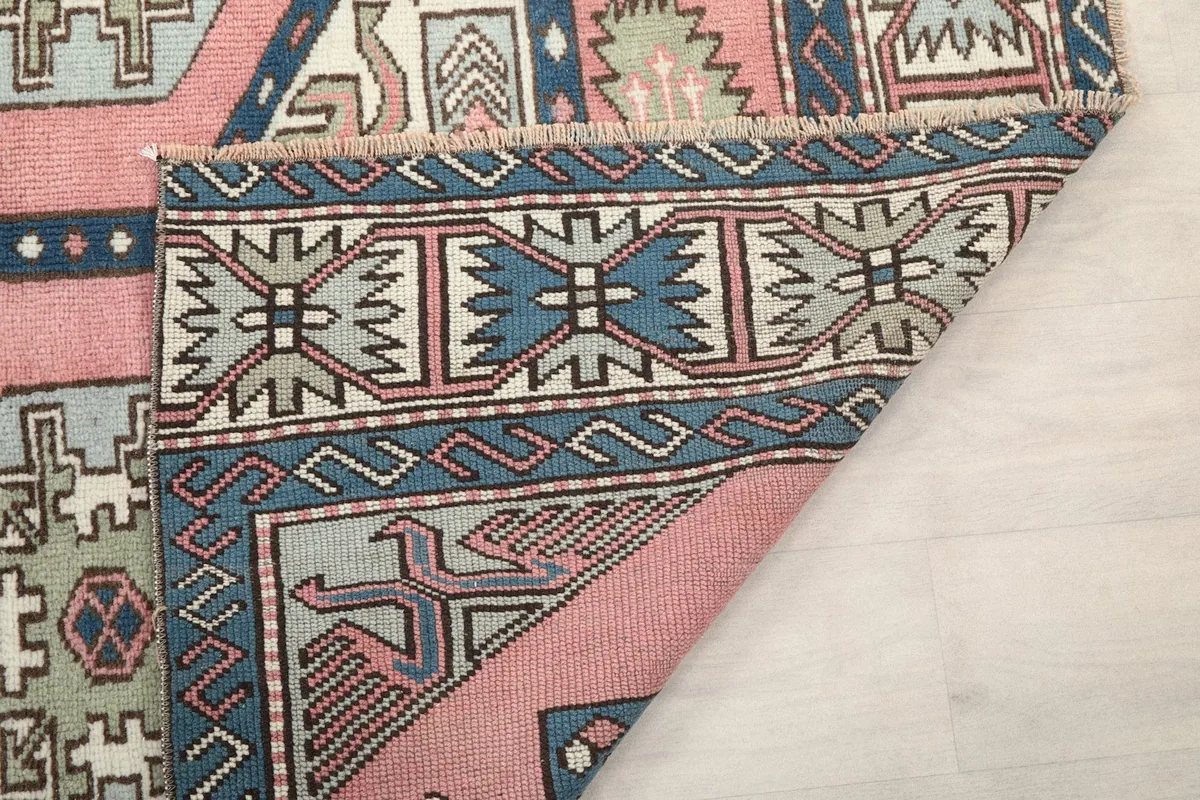 Underside of the rug showing the cotton foundation and tight hand-knotting