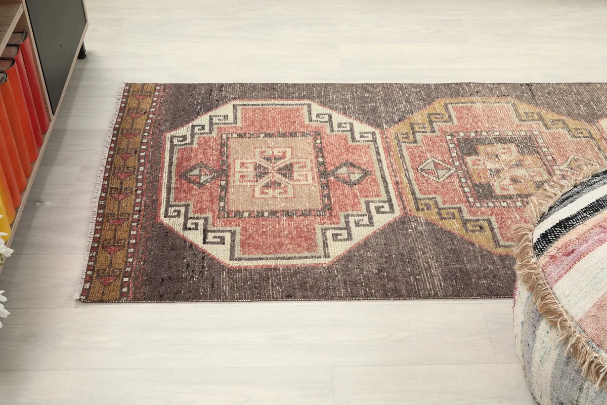 Overhead perspective of the rug, emphasizing the continuous flow of the geometric design.