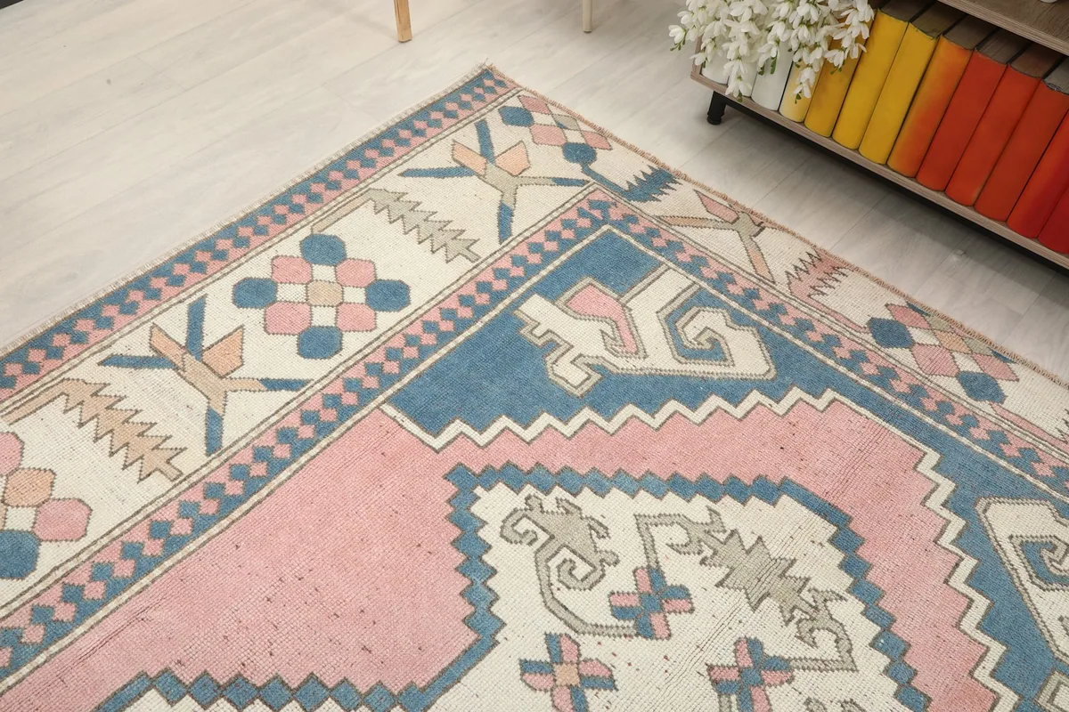 Corner view of the geometric rug, highlighting its colors and patterns
