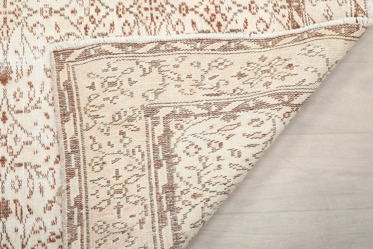 Underside of the rug revealing the intricate knots and foundation