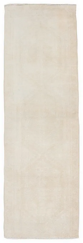 Full overhead view of the 2'11" x 9'6" ivory vintage Anatolian runner rug on a white background.